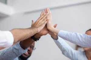 Multi,Ethnic,Corporate,Office,Business,Team,Winners,Join,Hands,Give